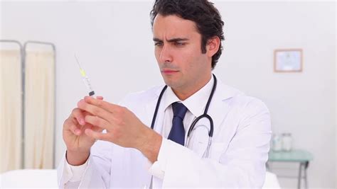 male gynecologist standing in front of woman stock footage