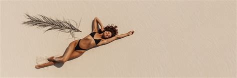 premium photo top aerial drone view  woman  swimsuit bikini relaxing  sunbathing  beach