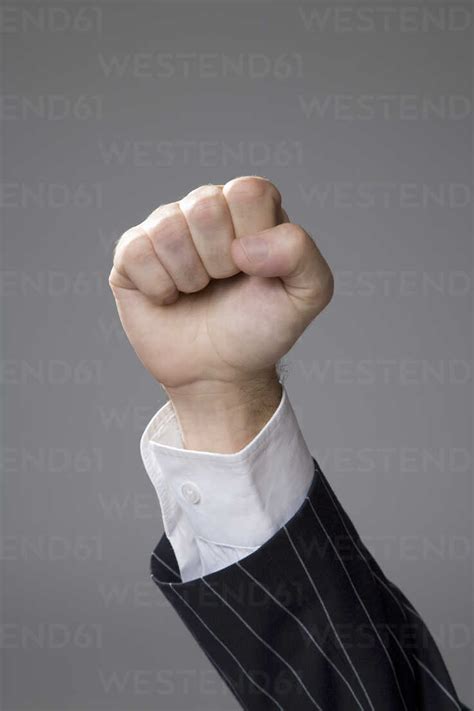 man making hand gesture fist close  stock photo