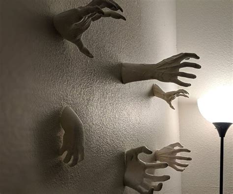 wall mounted reaching hands