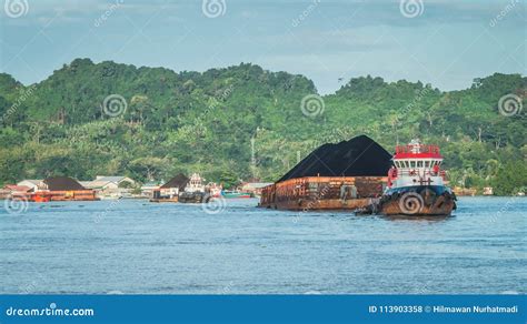 tugboat pull heavy loaded barge  coal stock photo image  black mining