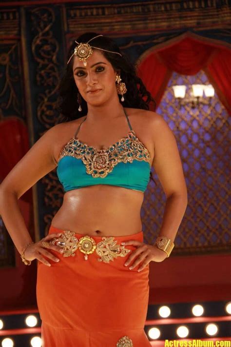 varalaxmi sarathkumar navel hip show photos from tamil movie in yellow