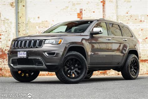 lifted  jeep grand cherokee   fuel tactic wheels    rough country lift kit