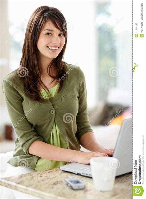 happy cute teen girl using a laptop at home stock image image of emailing attractive 11418125