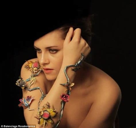 kristen stewart goes topless and cracks a rare smile in behind the scenes video of her