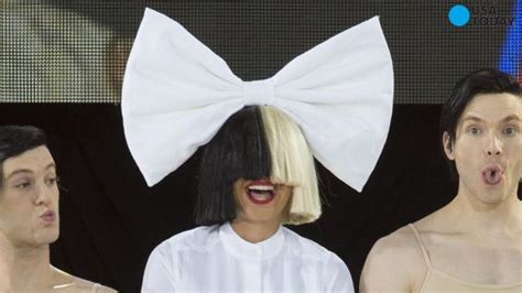 sia finally removes her wig for an airport stroll
