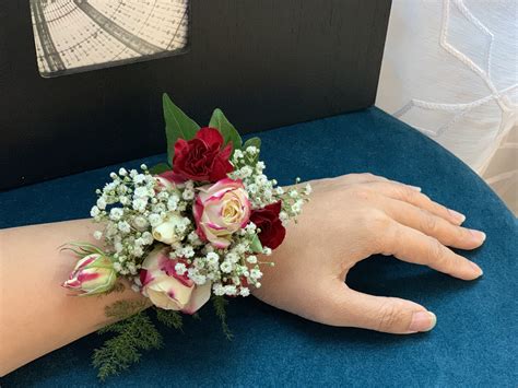 stunning red  white wrist corsage fresno florist signature floral designs fresno tx