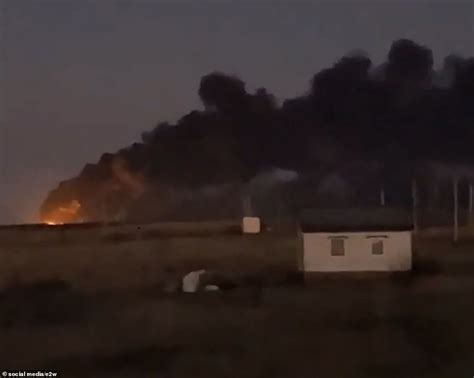 suspected ukrainian drone attack hits  russian airbase daily mail