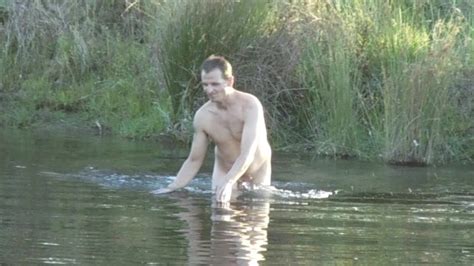 at the river naked swimming