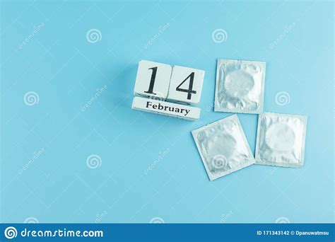 condom on blue background healthcare safe sex and love concept stock