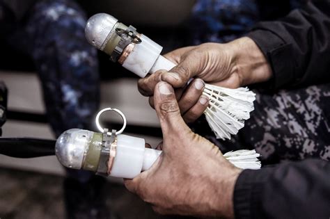 war  isis  involves shuttlecock grenades dropped  drones