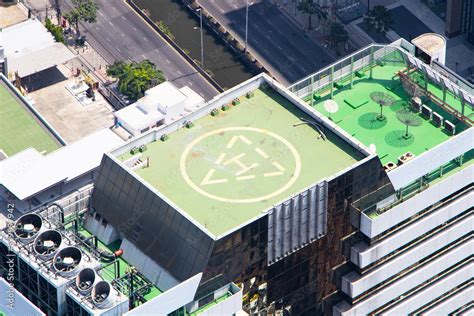 helicopter landing pad square shape color green  top  skyscraper