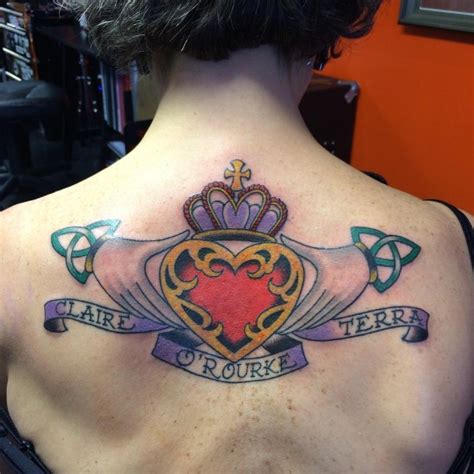 Old School Style Colored Upper Back Tattoo Of Hands Holding Heart With