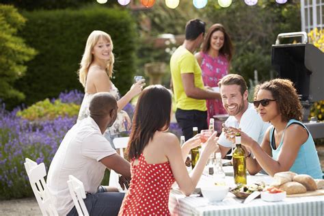 Group Of Friends Having Outdoor Barbeque At Home Austin Homes For