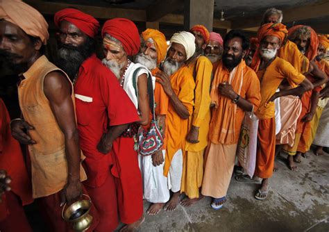 hindu holy men queue up to register for the annual pilgrimage to the