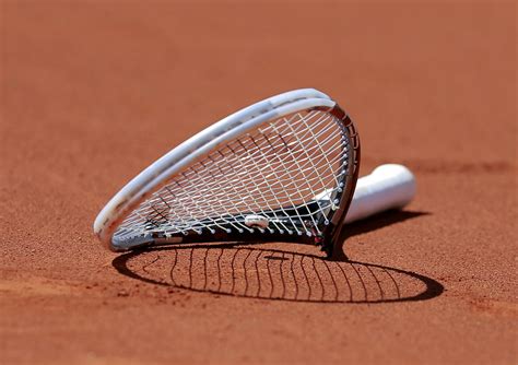 broken racket  novak djokovic  serbia     court