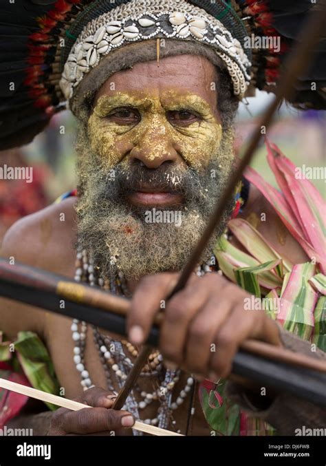 goroka province singsing group archer  bow  arrow  tribal face paint goroka show