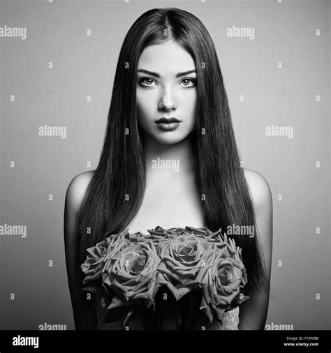 Portrait Of Beautiful Dark Haired Woman With Flowers Black And White