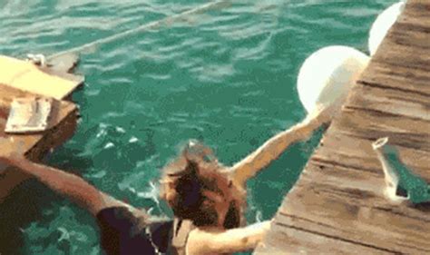 girl does splits trying to climb onto raft life life and style