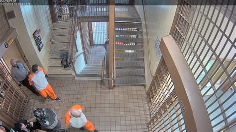 graphic video surveillance video shows inmates attack stab guard