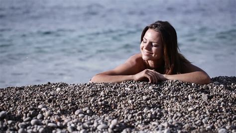 naked girl on pebble beach stock footage video 6949255 shutterstock