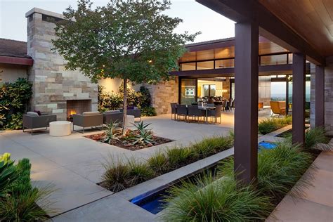 santaluz ranch home courtyard  outdoor dining  fireplace midcenturymodern contemporary