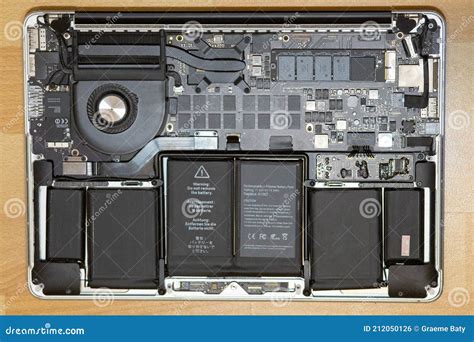 macbook pro  internal parts  repair battery replacement editorial photo image