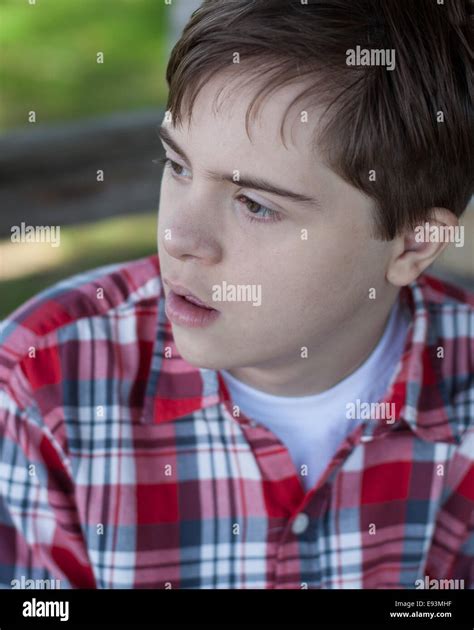 teenage boy  autism  downs syndrome   red plaid shirt stock photo alamy