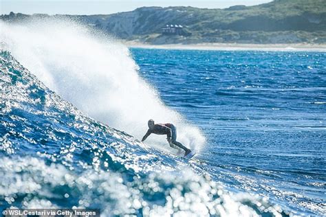 julian wilson is rushed onto a jet ski as a shark nears