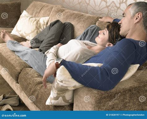 couple lying   sofa stock image image  baby male