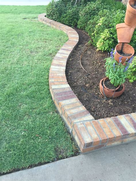 beautiful brick flowerbed border groundscape installed