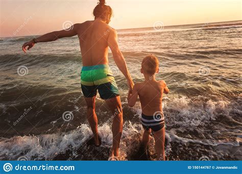 Father And Son Playing On The Beach Stock Image Image Of