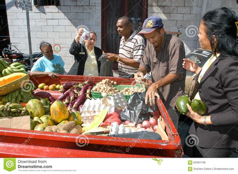 Street Seller Selling Food From His Car To People