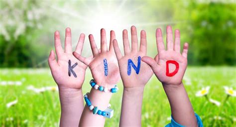 children hands building word kind means kid grass meadow stock image image  affable child