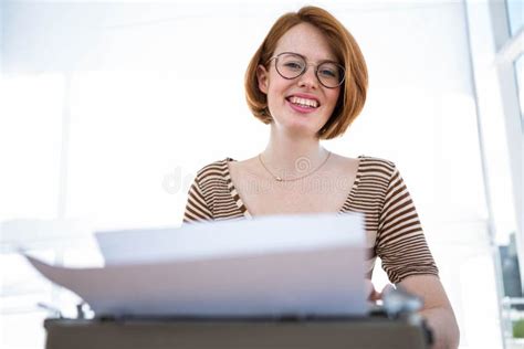 smiling hipster woman typing   typewriter stock image image