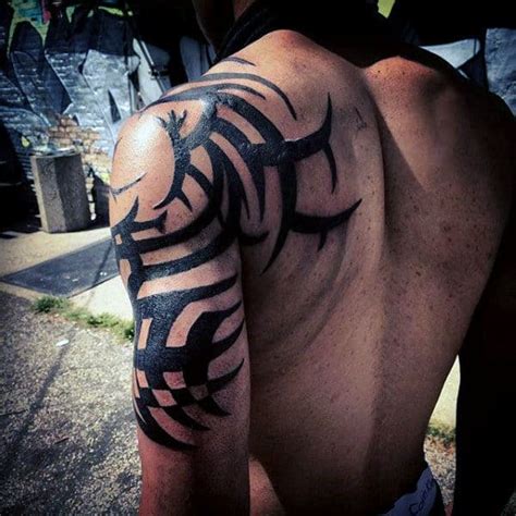 75 tribal arm tattoos for men interwoven line design ideas