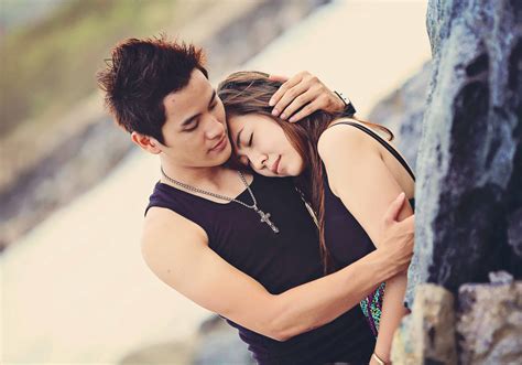 Download Korean Couple In Sleeveless Black Tops Wallpaper