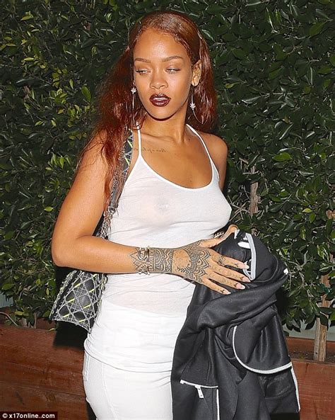 rihanna braless in see through top after video catches her