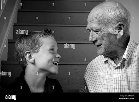 Black And White Portrait Of A Grandpa With His Happy Grandson Stock