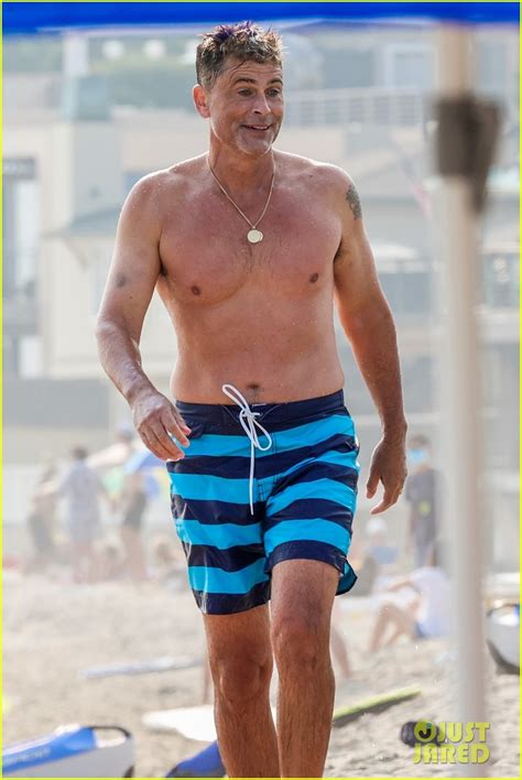 full sized photo of rob lowe shows of fit shirtless figure beach 05