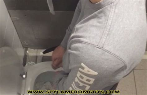 watch this guy peeing in a public bathroom spycamfromguys hidden cams spying on men