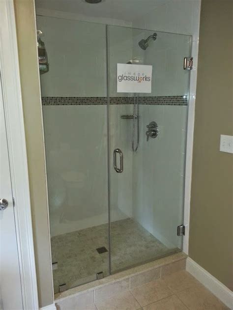 Swinging Frameless Shower Door That Closes Against A