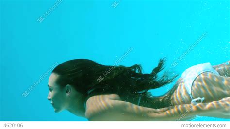 woman swimming underwater stock video footage