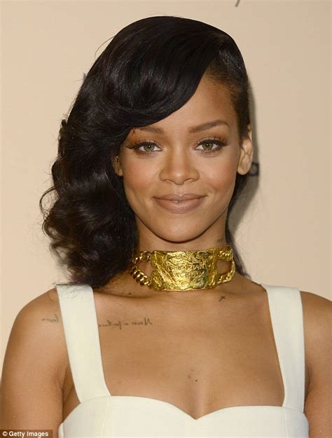 rihanna looks picture of innocence as she launches new
