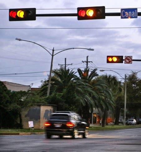 car    intersection   stop light turns red   camera  issue