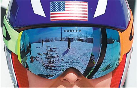 american lindsey vonn peers through her visors ahead of downhill