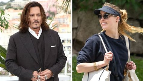 amber heard can t stop smiling as johnny depp postpones tour amid