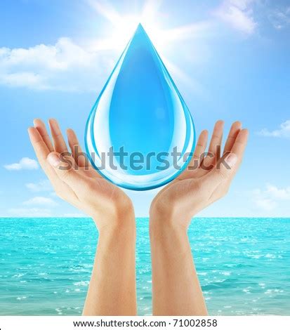 hand holding water drop stock photo  shutterstock