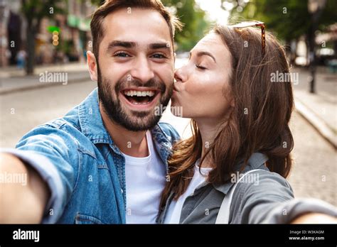 Beautiful Young Couple In Love Standing Outdoors At The City Street