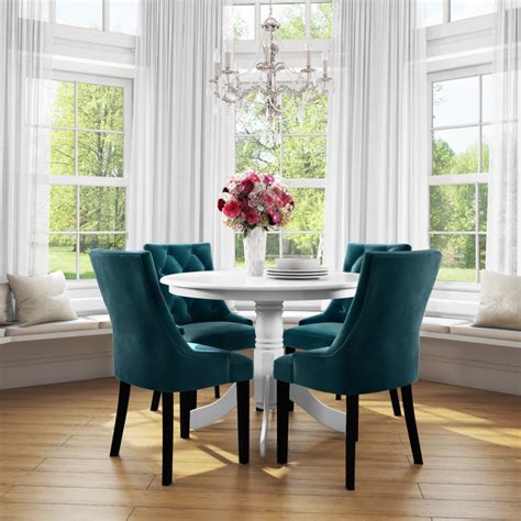 small  dining table  white   velvet chairs  teal blue